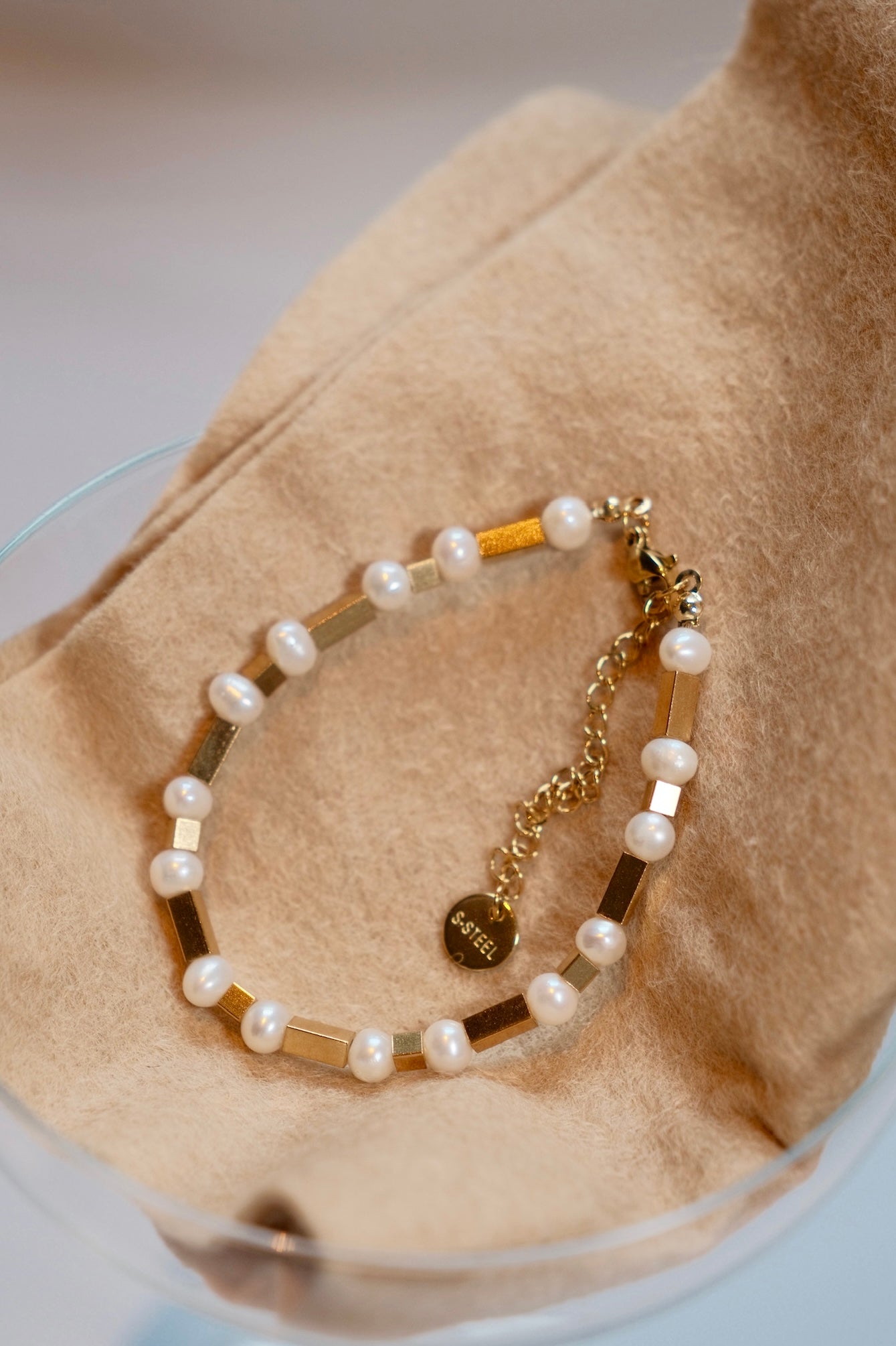 Simple and versatile fresh water pearl bracelet with rectangular stainless steel design