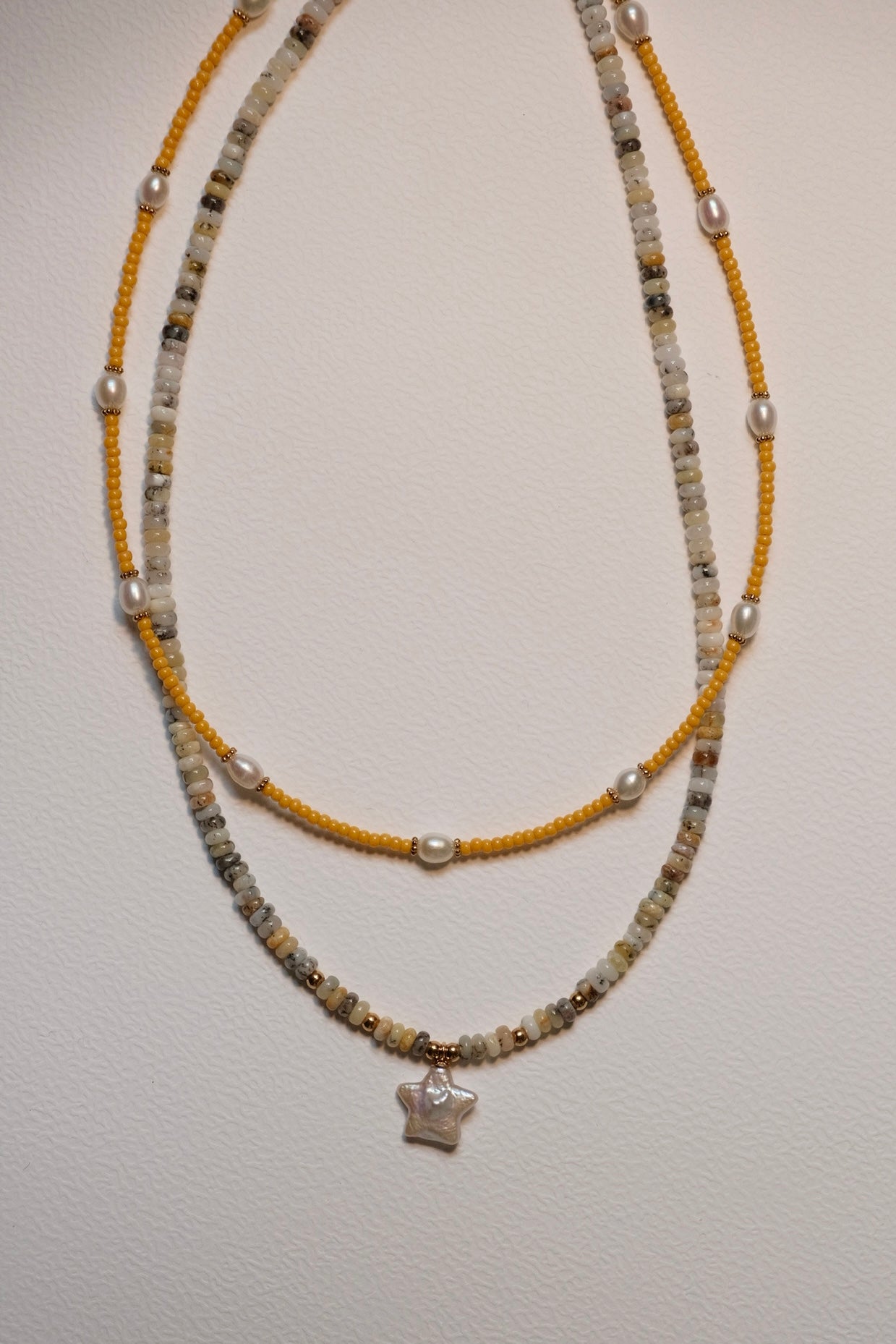 Cute yellow beaded and natural stone necklace with star-shaped pearl pendant